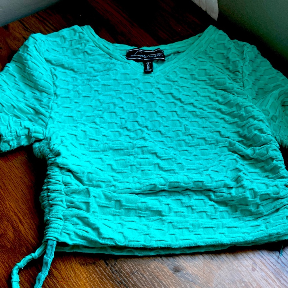 Love University cropped teal cinching side short sleeve with Athletic material.